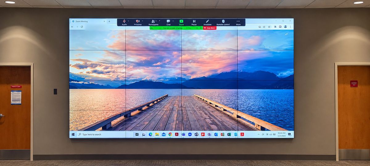Seamless 4x3 LCD video wall running a Zoom meeting, installed by Enlightened Audiovisual